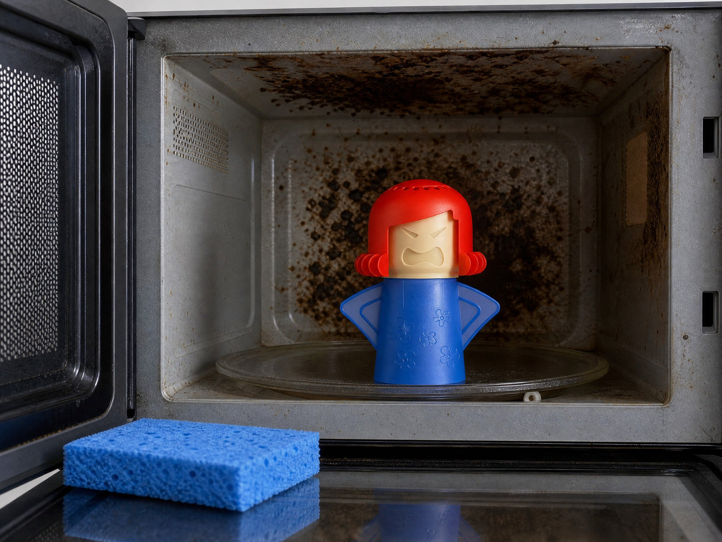 Carbonised crust still baked onto a microwave ceiling after one run