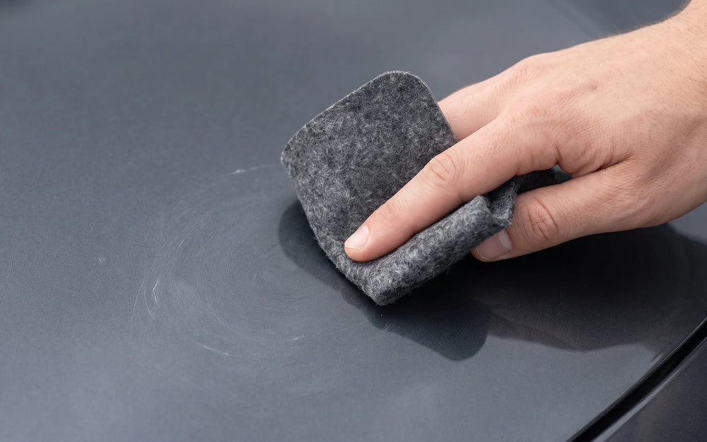 Working the cloth on a car panel