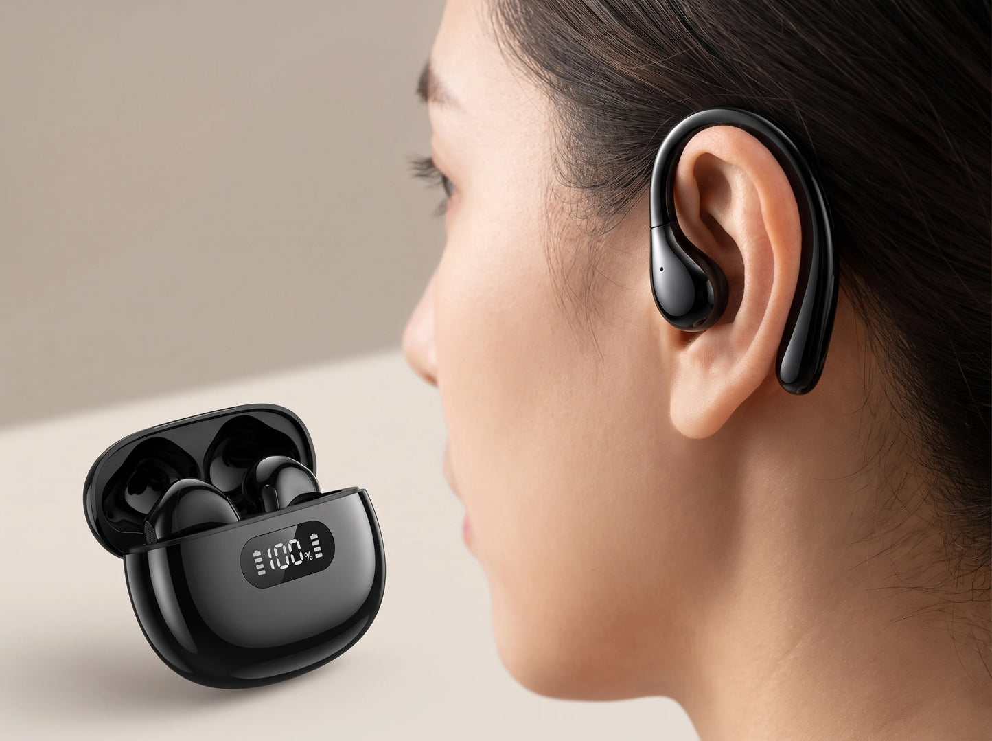 SonaBuds hook earphone worn over the ear, charging case beside it